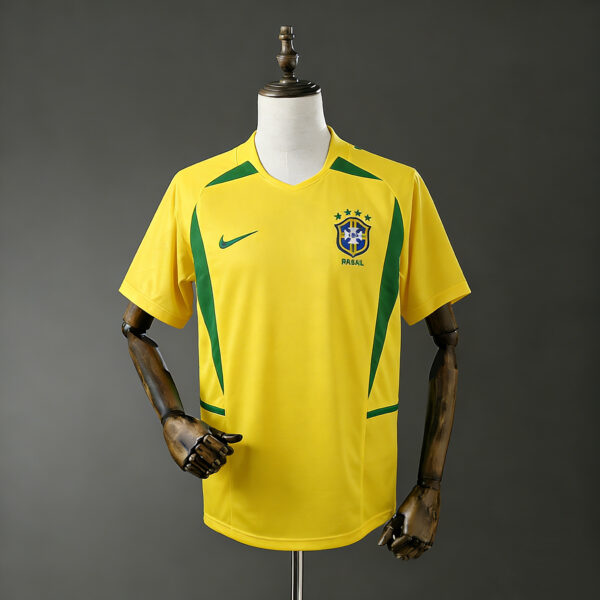 微信图片_20260409002737_145_1-600x600-1 Camisa Retrô em Casa da Seleção Brasileira na Copa do Mundo de 2002 – Número 11 - Imagem 1